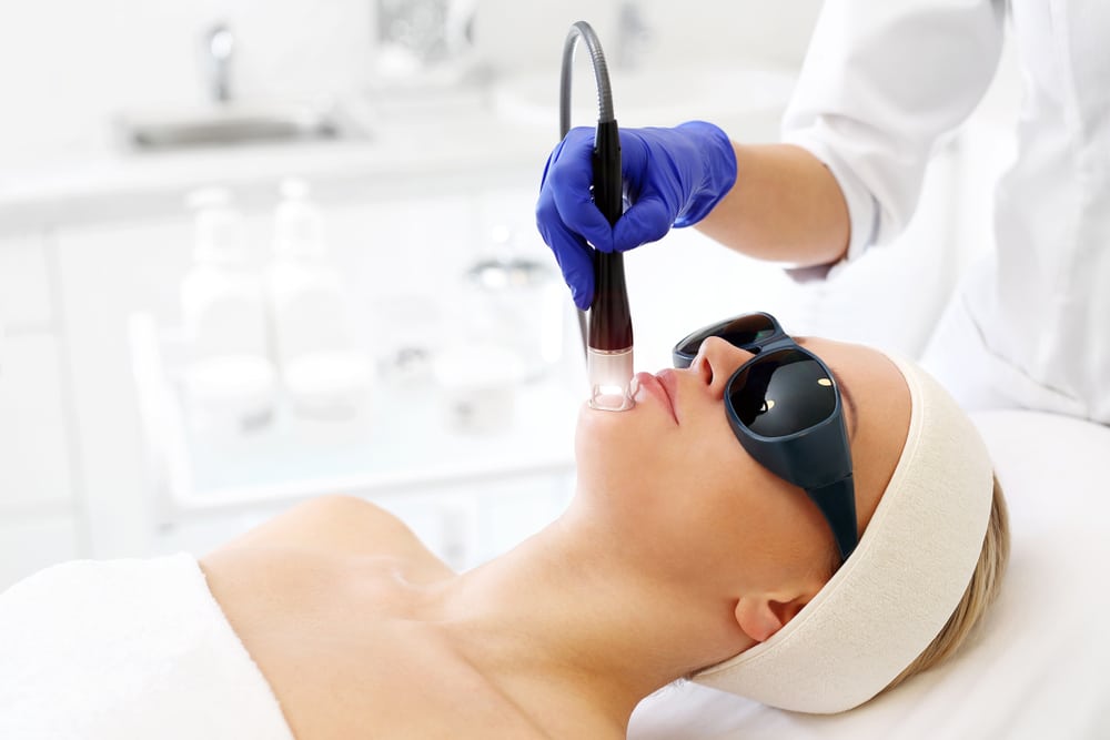 Woman receiving laser skin rejuvenation treatment